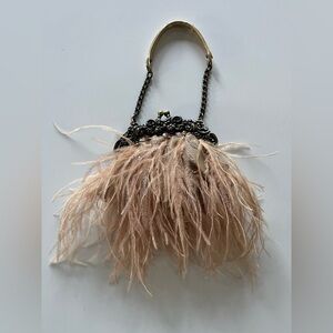 Tiny blush feather and beaded lace evening bag.